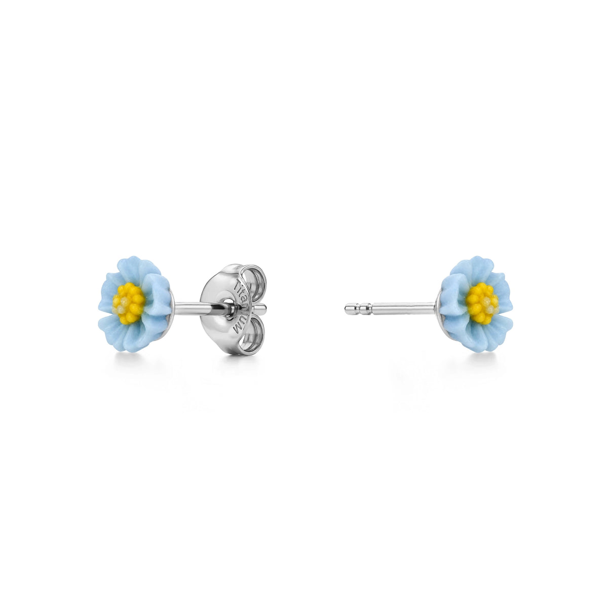 A pair of titanium stud earrings featuring pastel blue and yellow marigold-shaped enamel tops, shown on a clean white background with one earring facing forward and the other showing the backing.