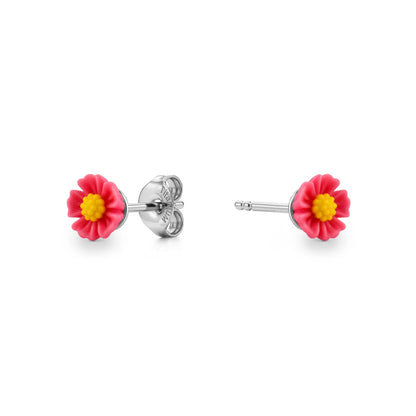 A pair of titanium stud earrings featuring small pastel pink daisy flowers with bright yellow centers, shown on a clean white background.