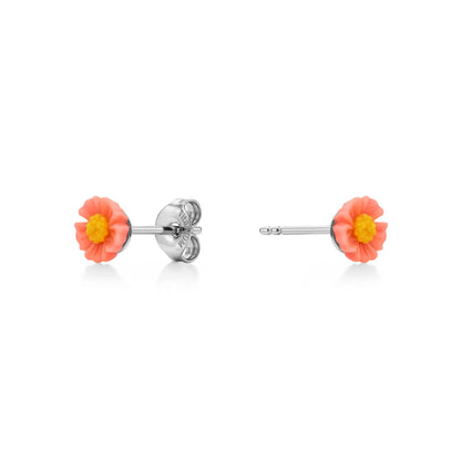 A pair of titanium stud earrings featuring small coral-pink flowers with bright yellow centers, shown on a clean white background with one earring facing forward and the other showing the back clasp.