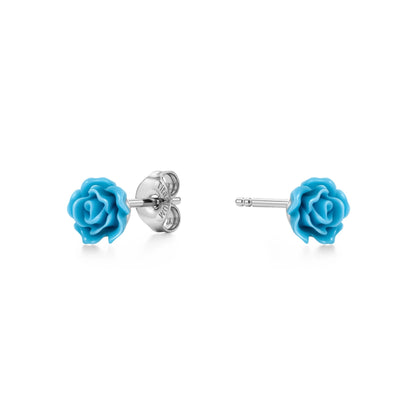 A pair of titanium stud earrings featuring bright blue rose-shaped enamel tops, shown on a clean white background with one earring facing forward and the other showing the backing.