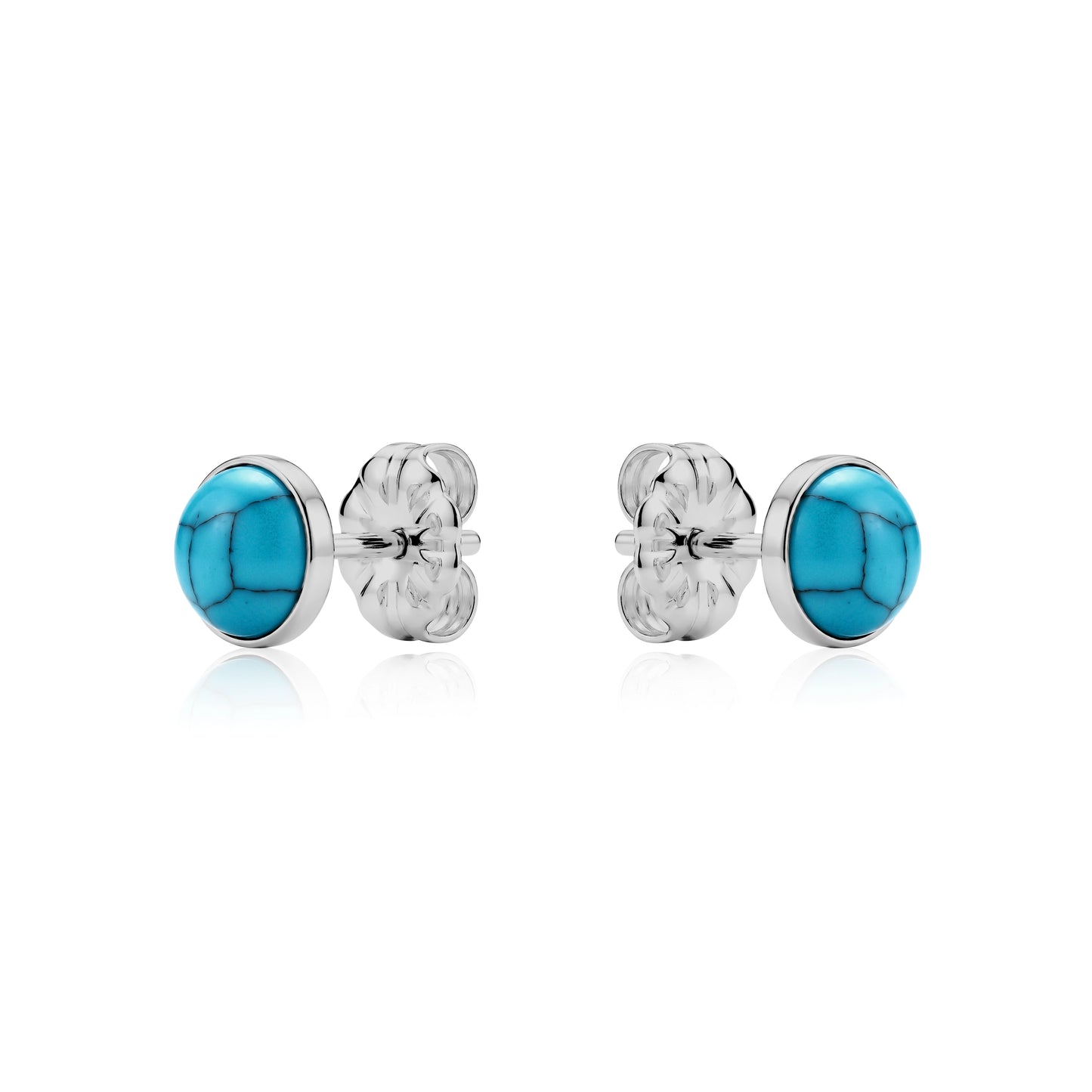 Pair of titanium earrings with light blue stones on a white background