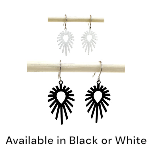 Shine teardrop black/white earrings with a titanium hook on a white background