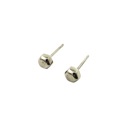 Small Cap Nut Studs -solid titanium studs - Feature a small and minimal design on a white background