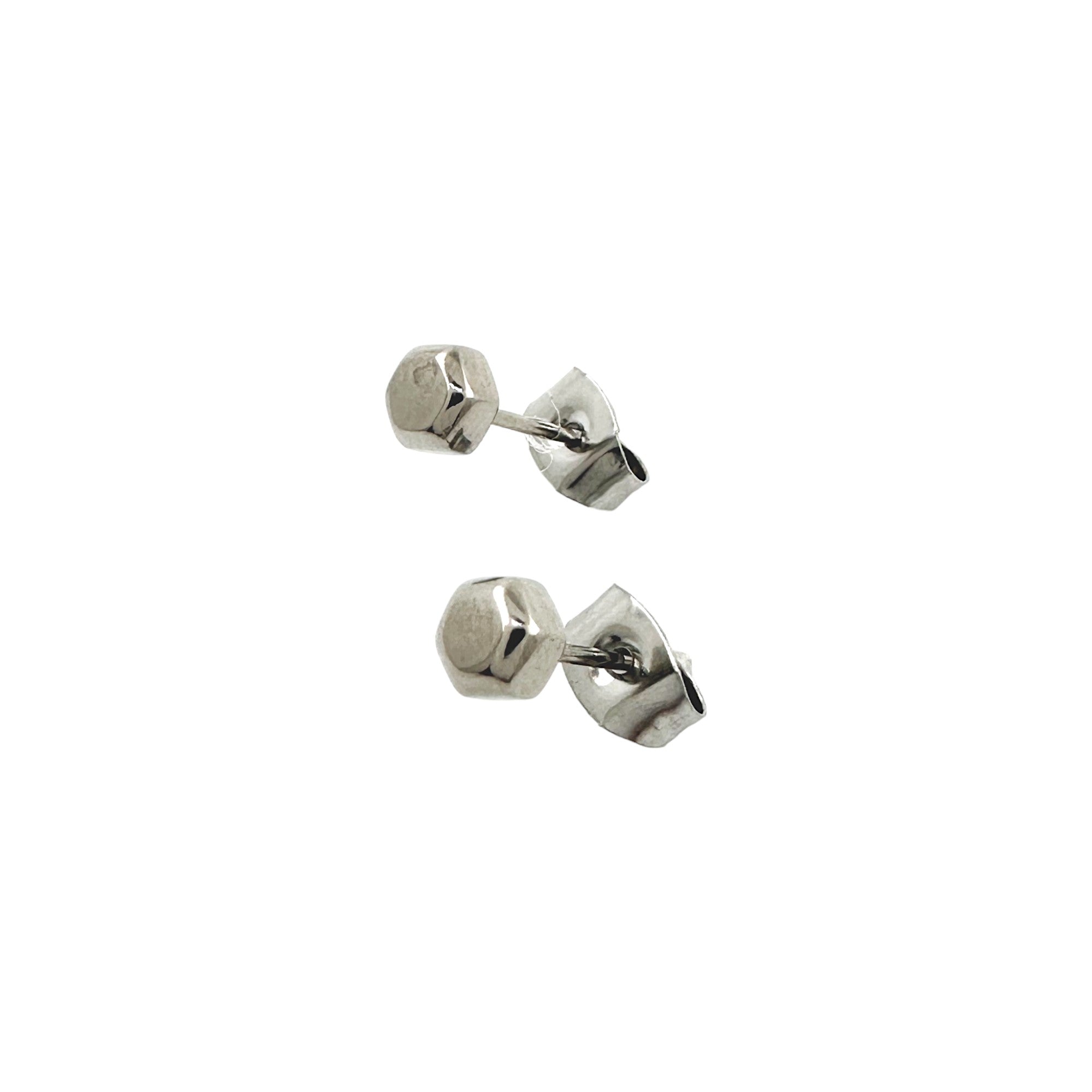 Small Cap Nut Studs -solid titanium studs and backs- Feature a small and minimal design on a white background