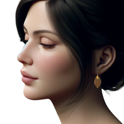 Gold disc leaf earring and a titanium hook on a white young woman.