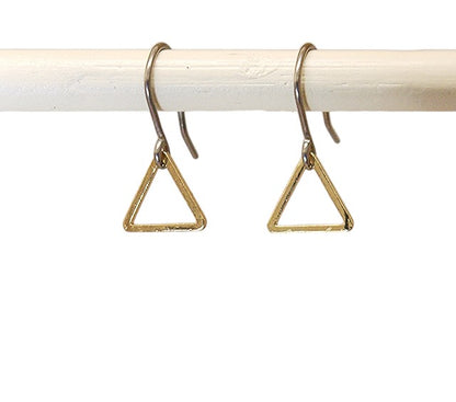 Minimal gold triangle drop earring with a titanium hook on a white background