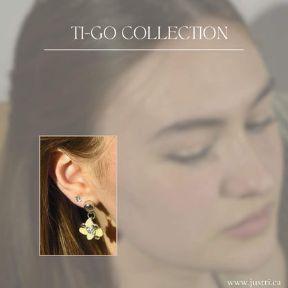 TI-GO Summer Blossom leaf earring. Detachable earrings for a truly hypoallergenic jewellery on a white young woman.