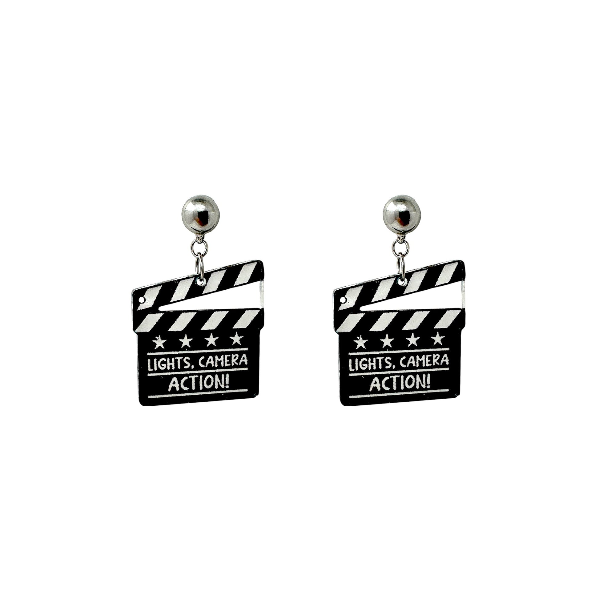 Lights camera action earrings with a titanium magnetic stud on a white background