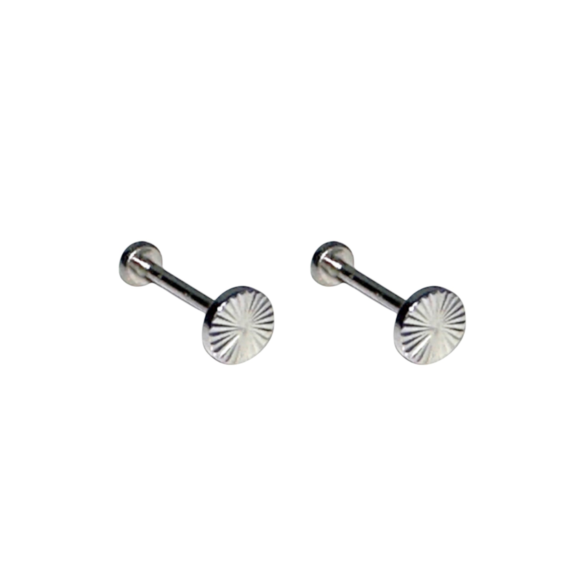 Titanium dremel flat back stud pair on a white background