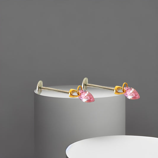 Hanging Marquise Pink flat back earrings gemstone on a gray pedestal against a gray background 