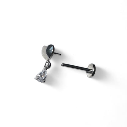 Titanium earring with heart and teardrop hanging gem on a white background
