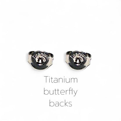 Two titanium butterfly earring backs on a white background with 'Titanium' text.