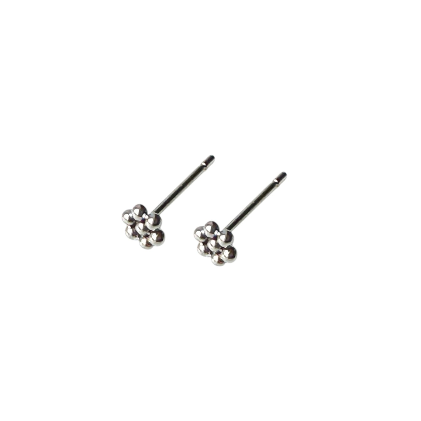 Titanium Ball Studs solid titanium studs and backs Feature a small and minimal design on a white background