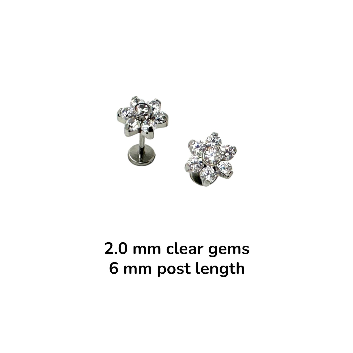 Pair of titanium earrings with clear 2.0 mm gemstones on a white background 6mm post