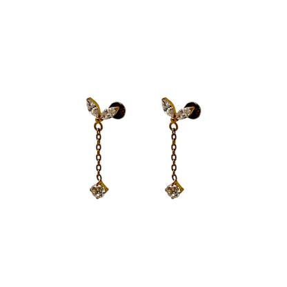 Pair of titanium flat back threadless 20 gauge earrings with clear leaf-like tops and gold chains on a white background
