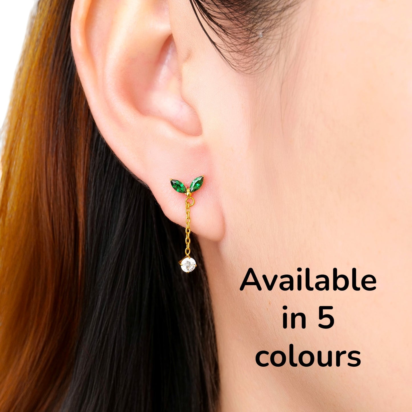 titanium flat back threadless earrings with  green leaf like tops and gold chains on a woman avalable in 5 colours