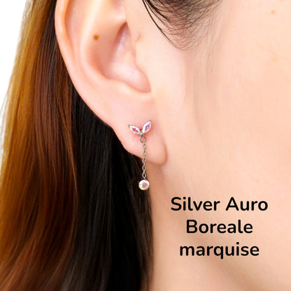 Close-up of an ear wearing a silver auro boreale  titanium flat back earring on a woman
