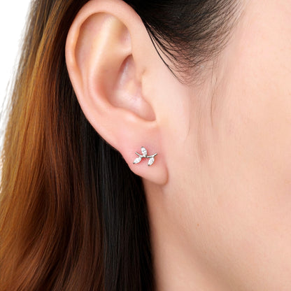 Close-up of an ear wearing a titanium flat back threadless earring with a woman