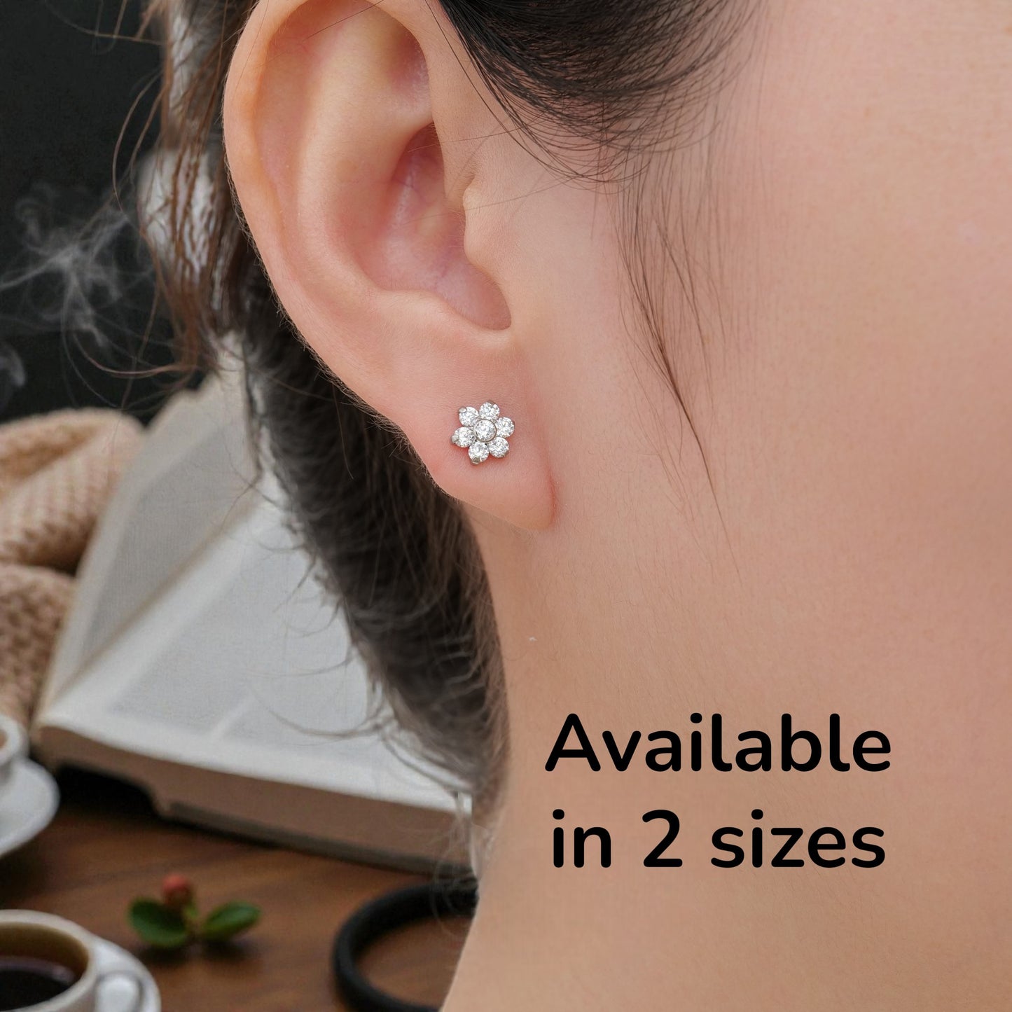 Flower ear studs with Gems available in 2 sizes. Titanium Studs  Studs shown on a white woman.