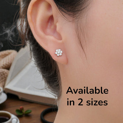 Flower ear studs with Gems available in 2 sizes. Titanium Studs  Studs shown on a white woman.
