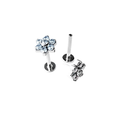 Titanium floral earring with clear gemstones on a white background