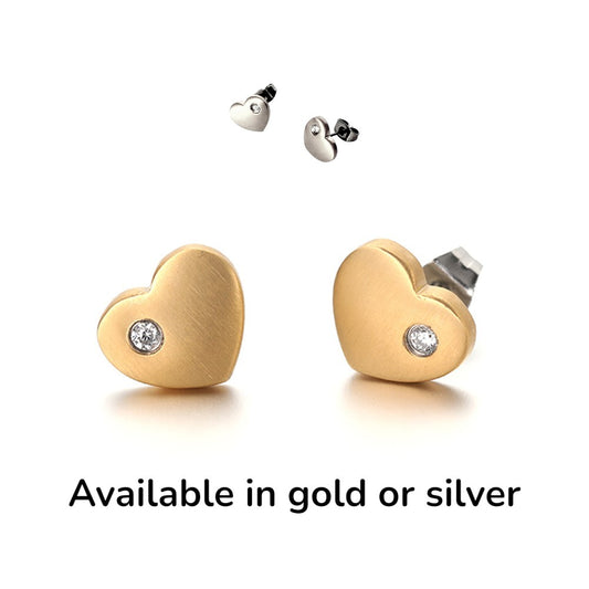Gold or silver titanium Diamond Heart Studs. These studs shown on a white background with avilability text
