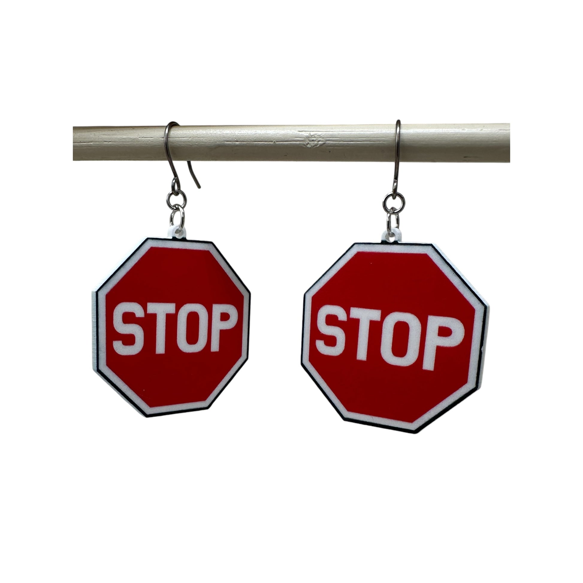 titanium stop sign earrings on a white background