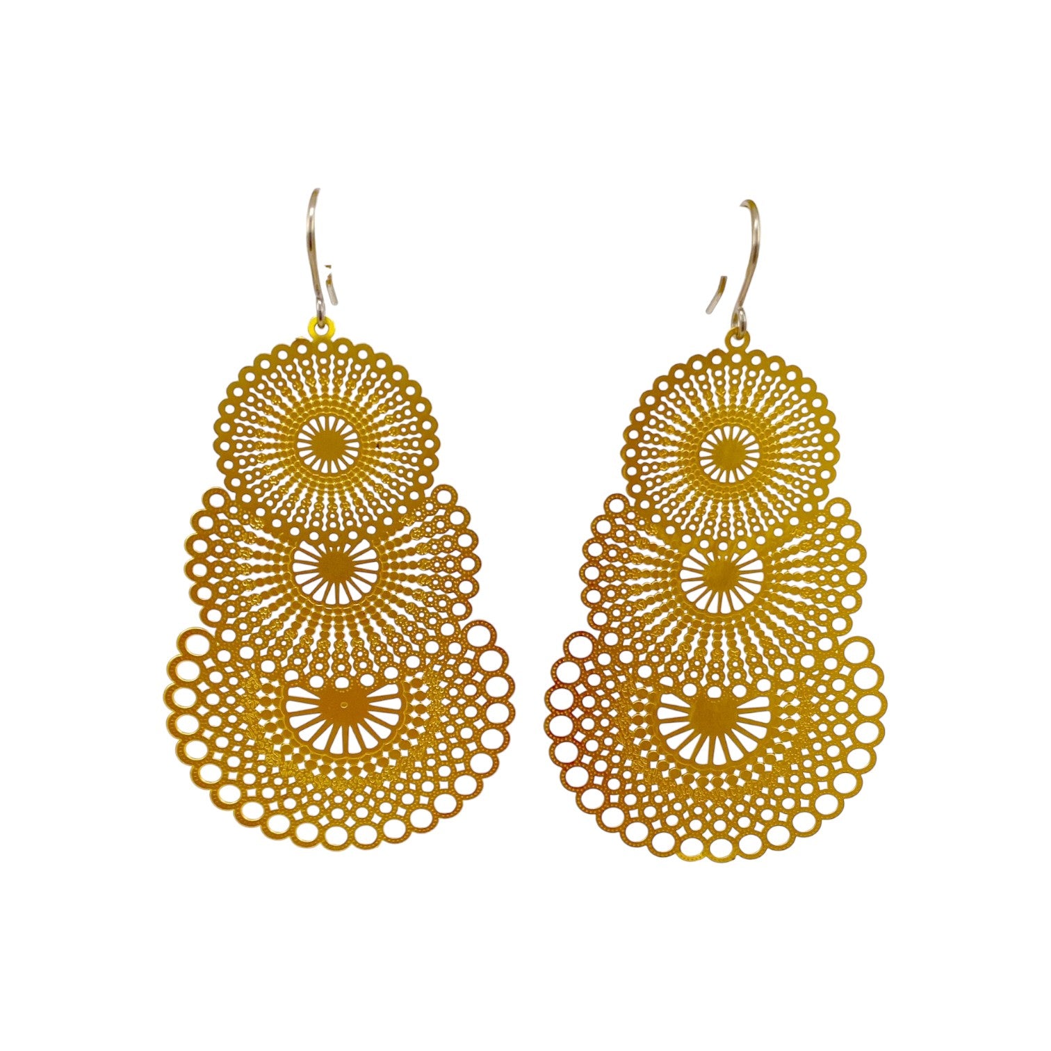 Triple gold disc drop earring with titanium hook. on a white background