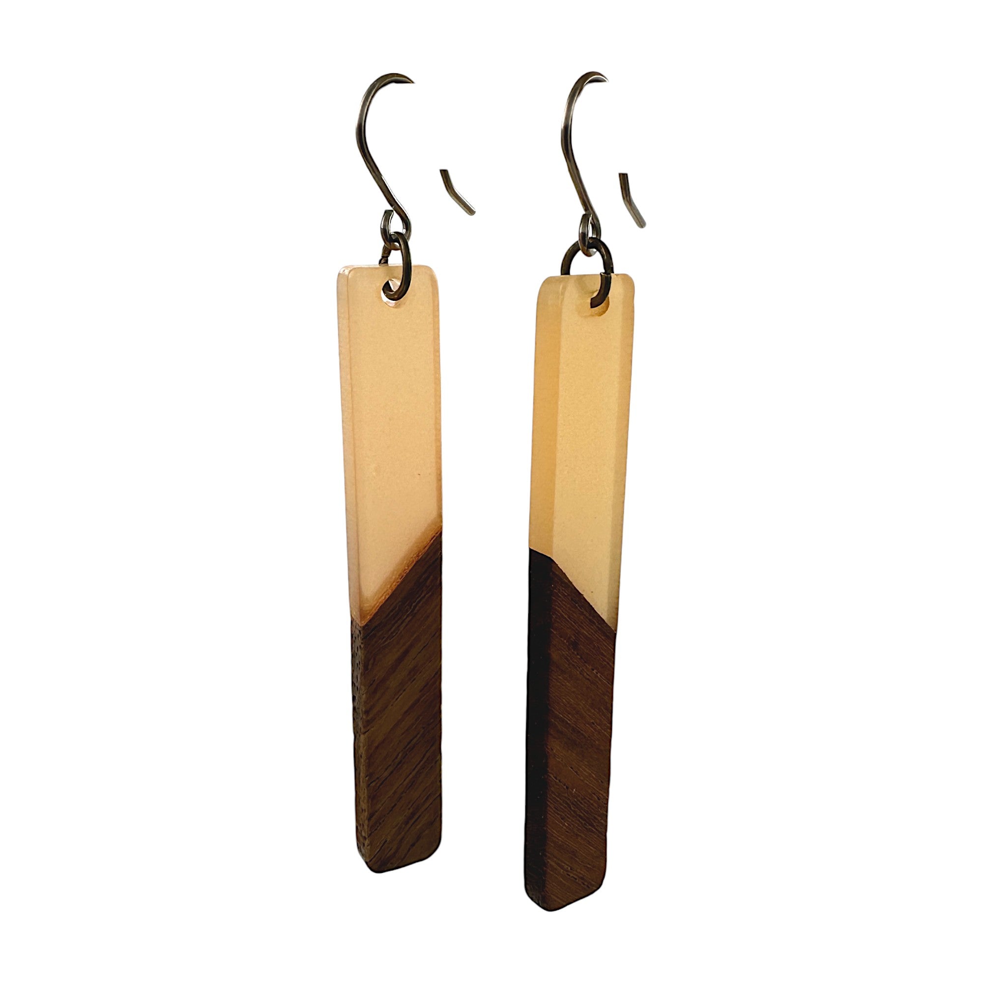 Translucent wood earrings with titanium hook. on a white background brown