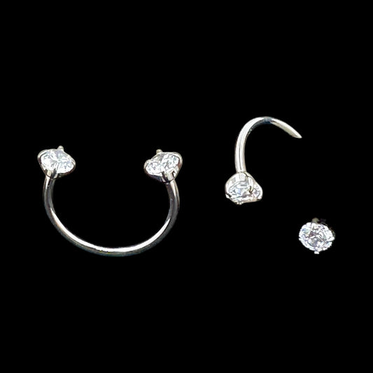 U-hoops titanium earring set with clear gemstones on a black background