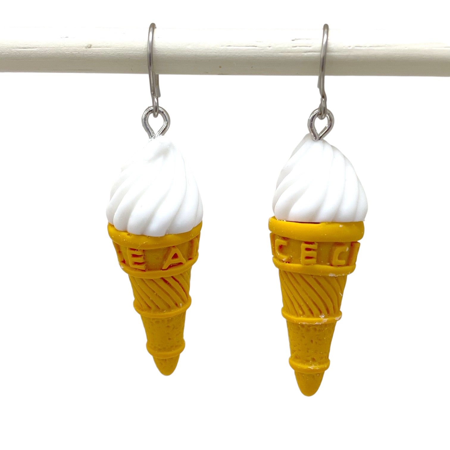 Ice cream earrings with a titanium hook on a white background