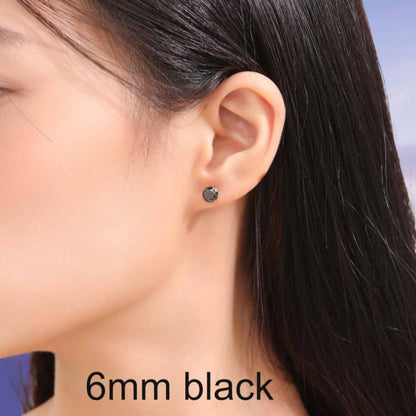 Close-up of an ear wearing a black titanium earring with '6mm black' text.