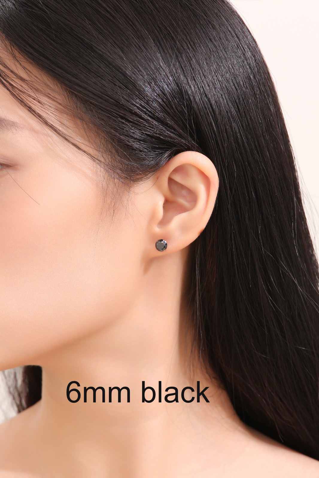 Black Gem Studs titanium large 6mm on a white woman