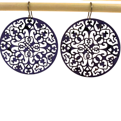 1large black geometric disc earrings with a titanium hook on a white background