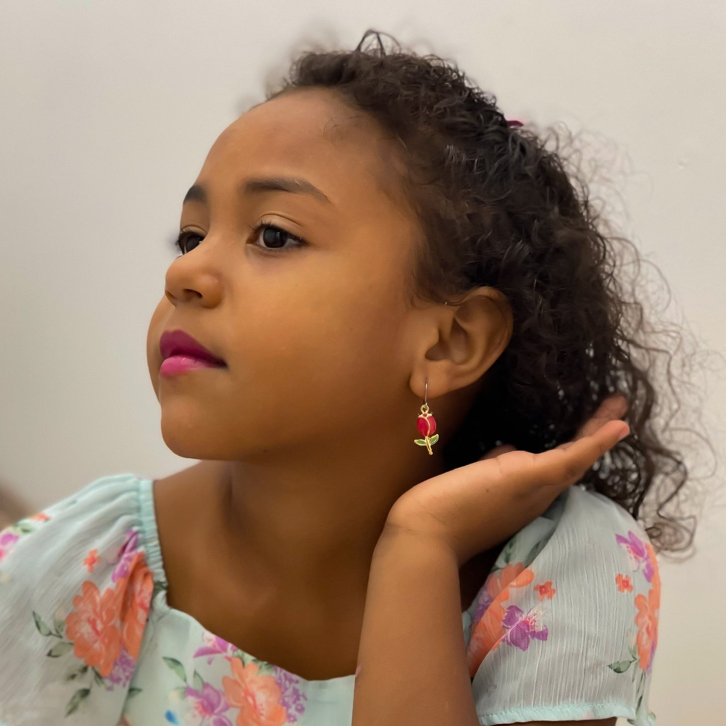 Tulip earrings with titanium hook. on a young girl.