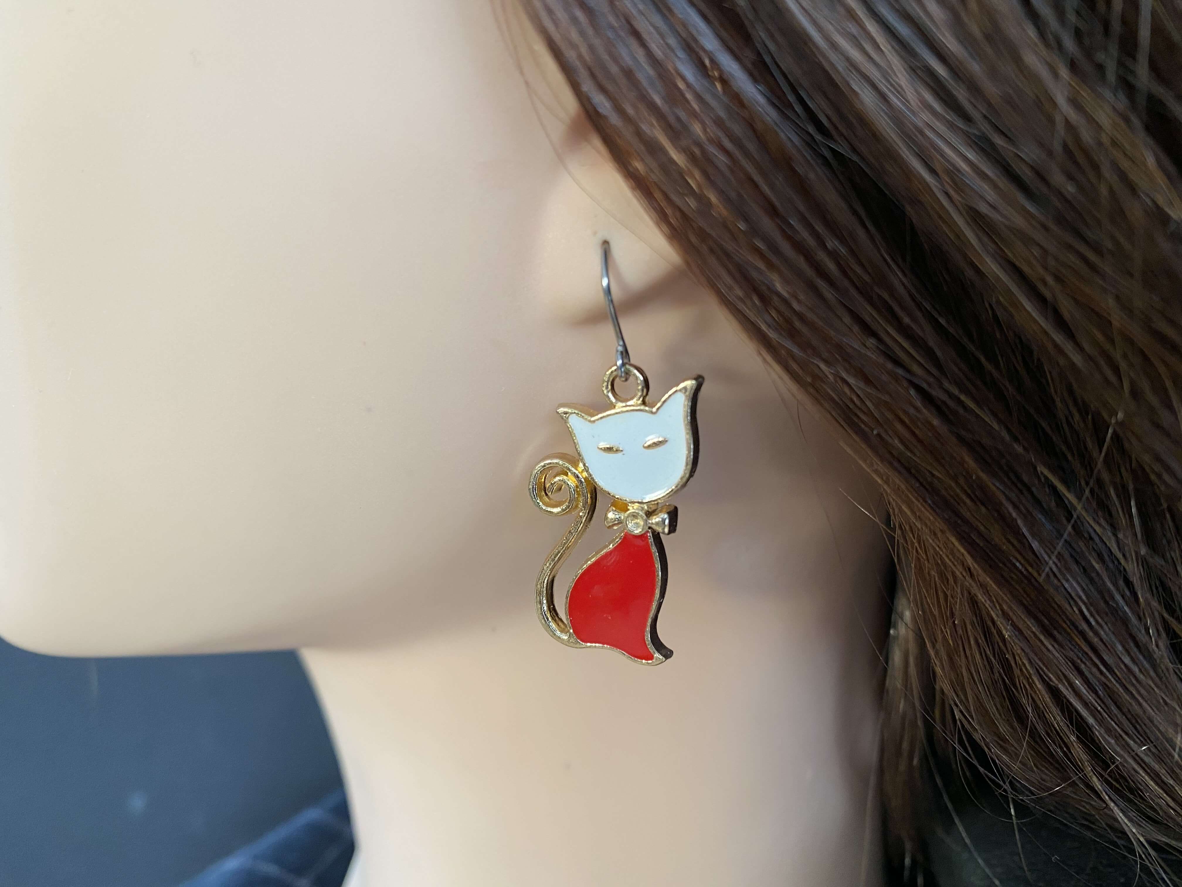 Cat Charm red on ear