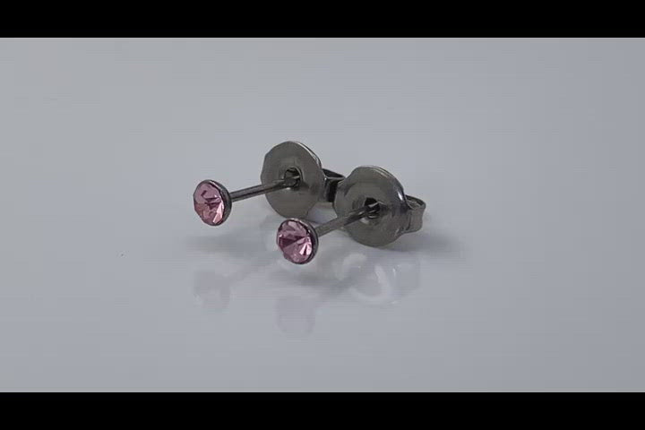 Pink Gem Studs -solid titanium studs and backs- Feature a small and minimal design on a white background