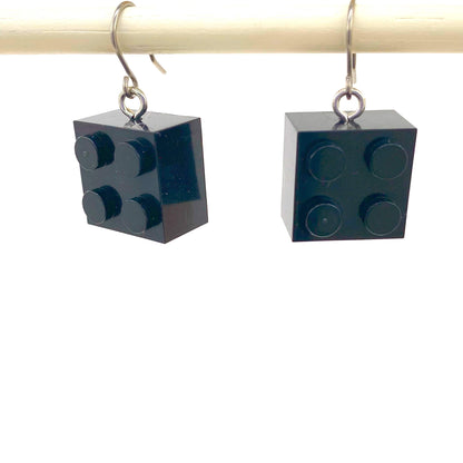 Lego block earrings with a titanium hook on a white background. black