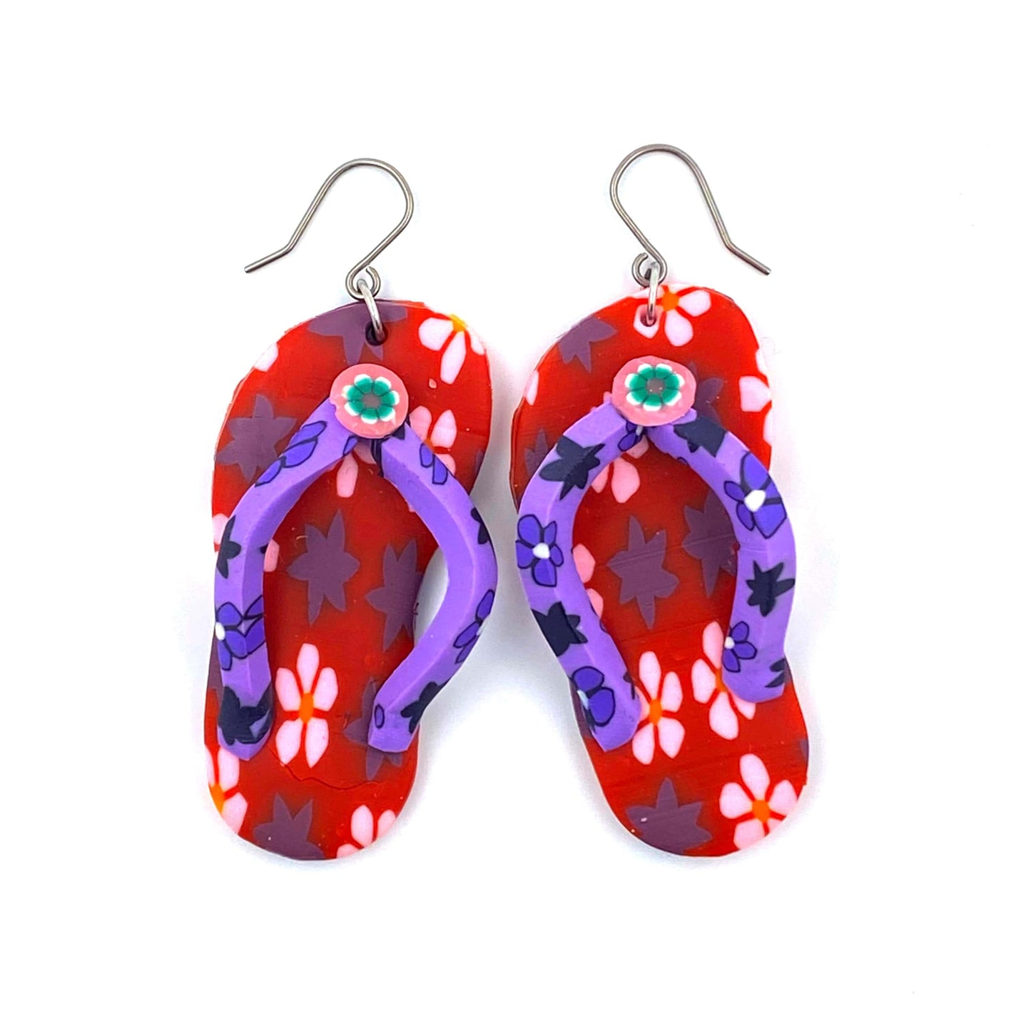 Flip flop earrings in red with a titanium hook on a white background