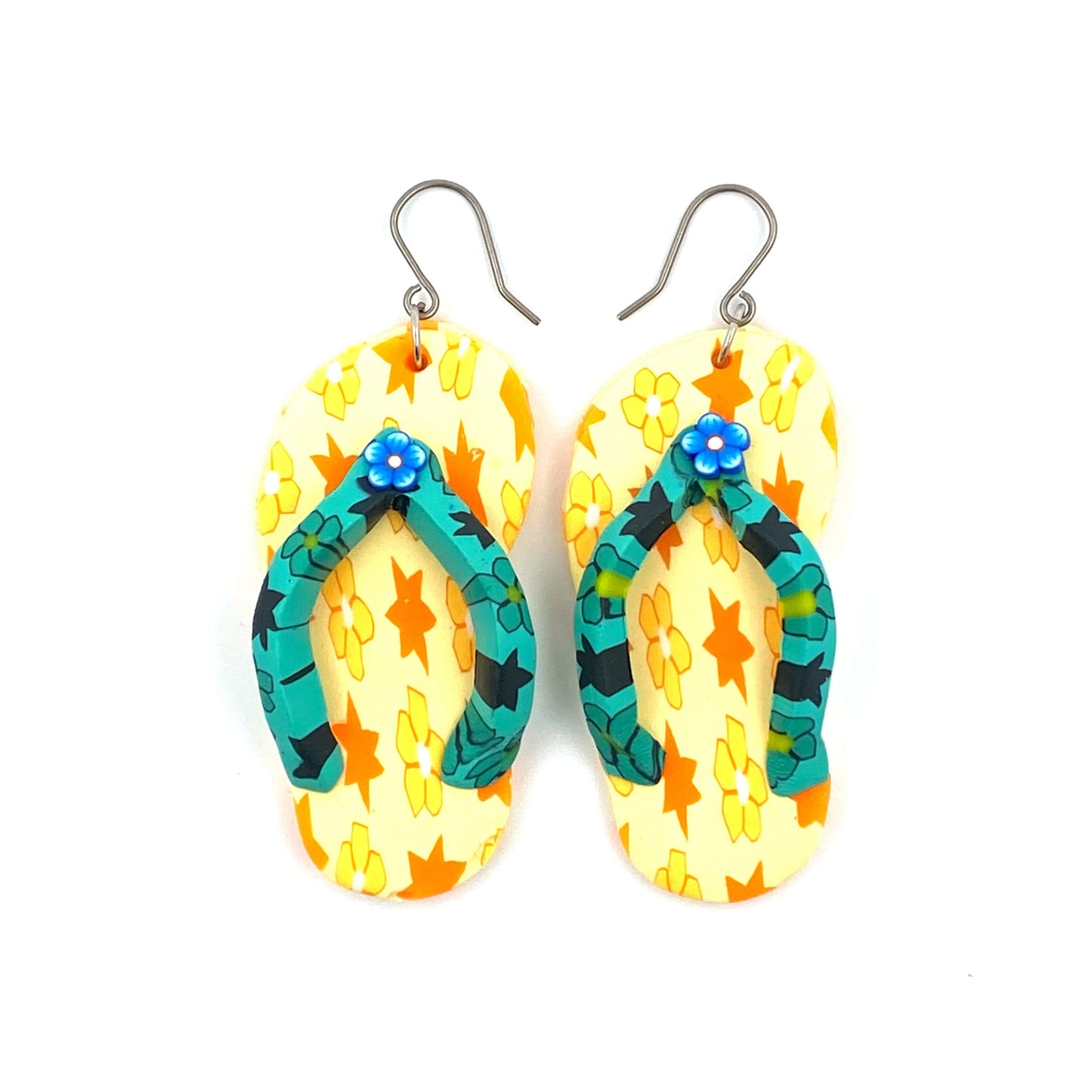 Flip flop earrings in yellow with a titanium hook on a white background