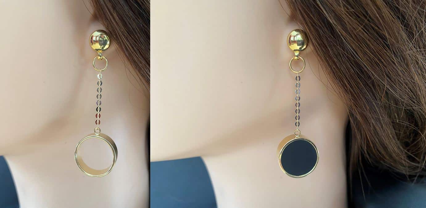 Gold chain and ring earring. Detachable earrings for a truly hypoallergenic jewellery on a white young woman. 