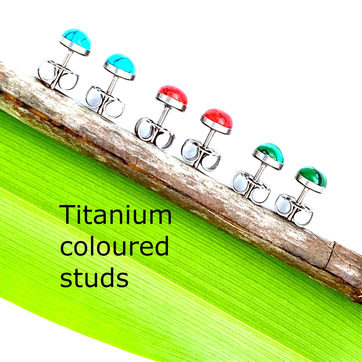 Marbled Studs -solid titanium studs and backs- Feature a small and minimal design on a white and green background. colours