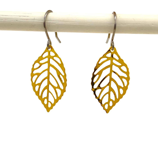 Mini golden leaf earring with a titanium hook on a white background