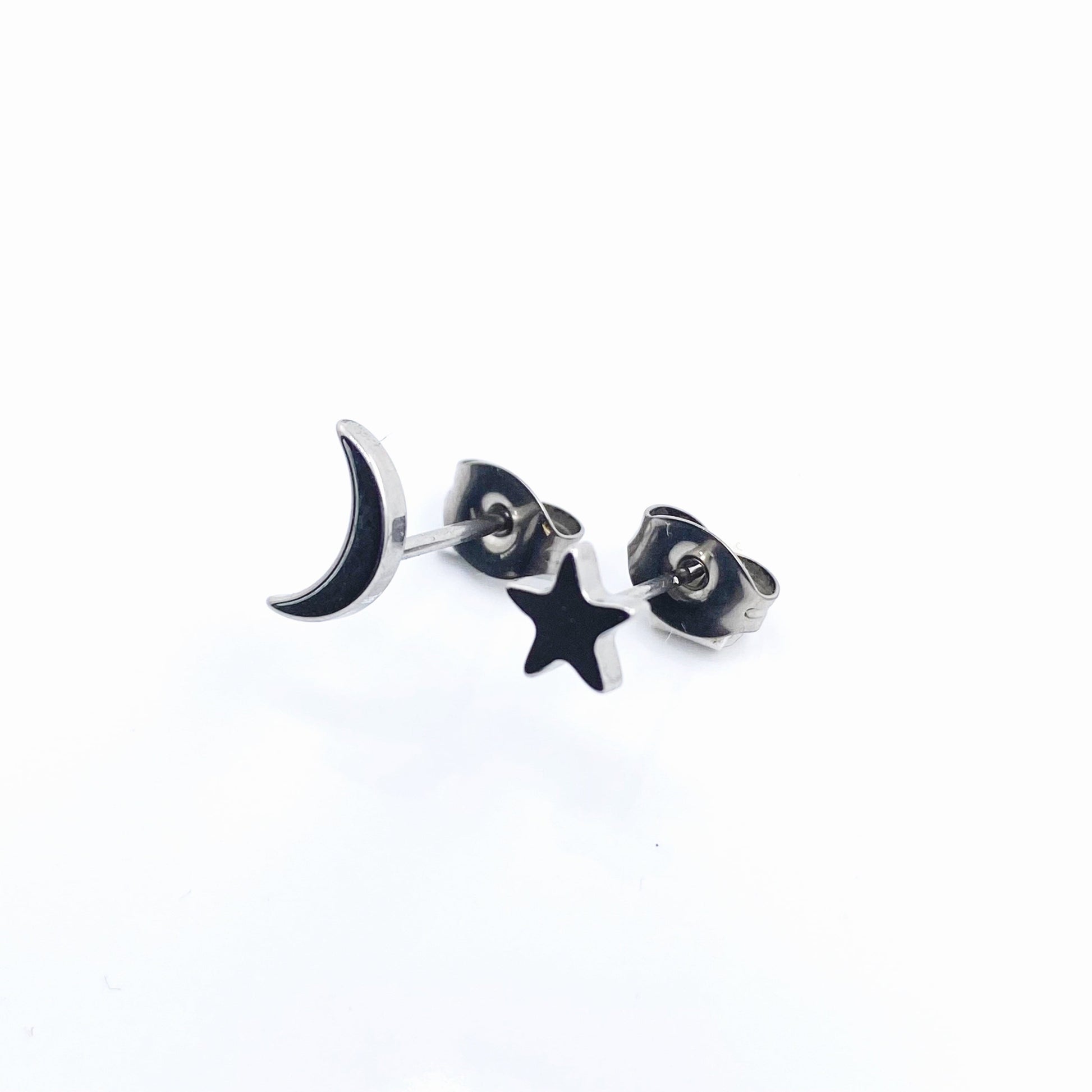Moon & Star Studs. Titanium Studs with titanium backs. These studs shown on a white background