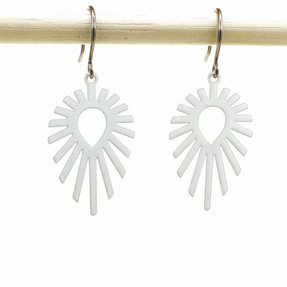 Shine teardrop white earrings with a titanium hook on a white background