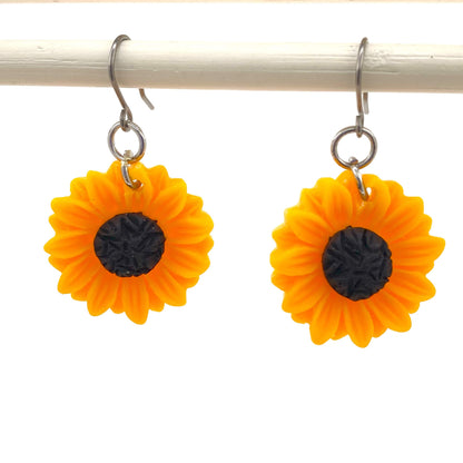 Sunflower earrings with a titanium hook on a white background