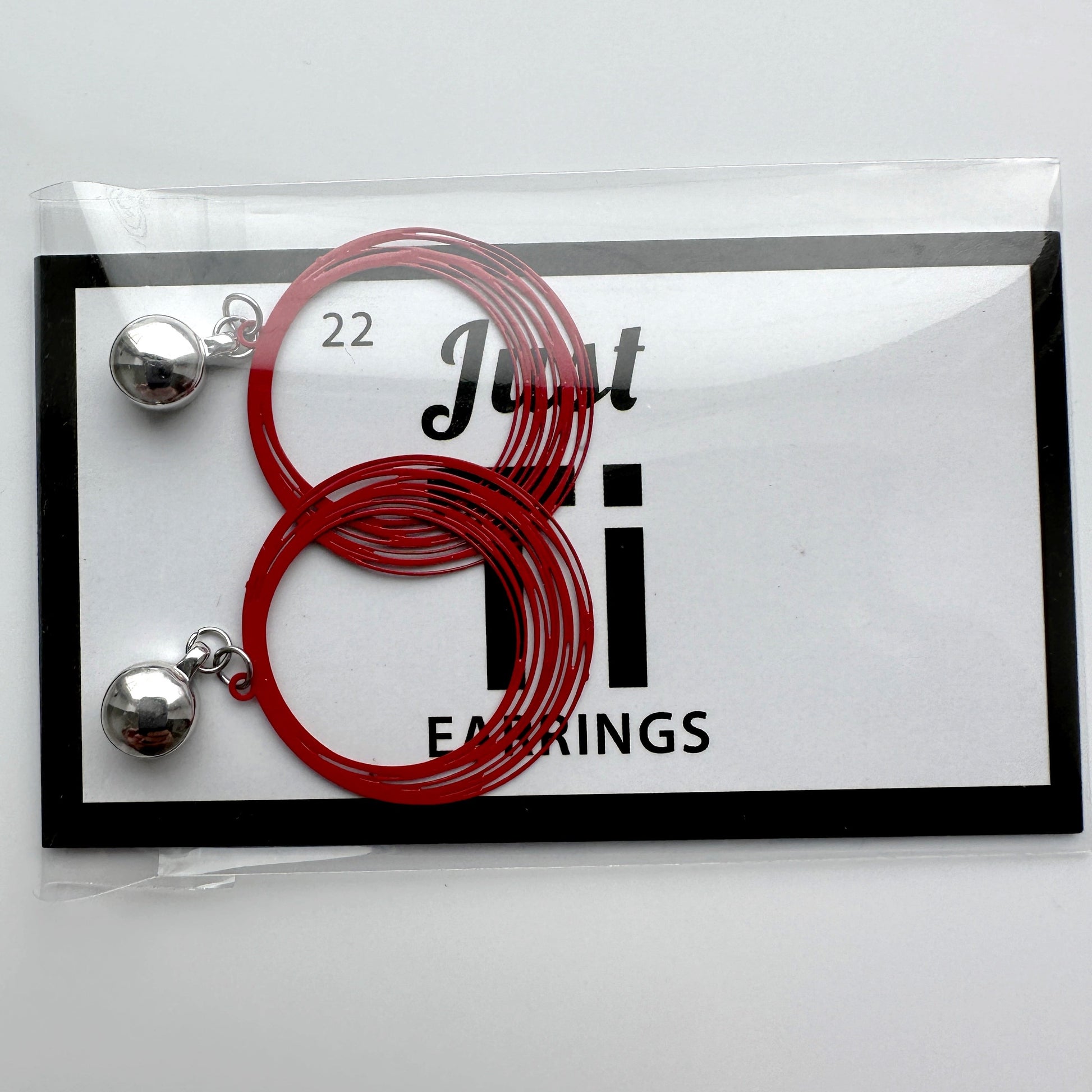 TI-GO Black / Red String Rings earring. Magnetic titanium interchangeable earring system. Detachable earrings for a truly hypoallergenic jewellery on a white card