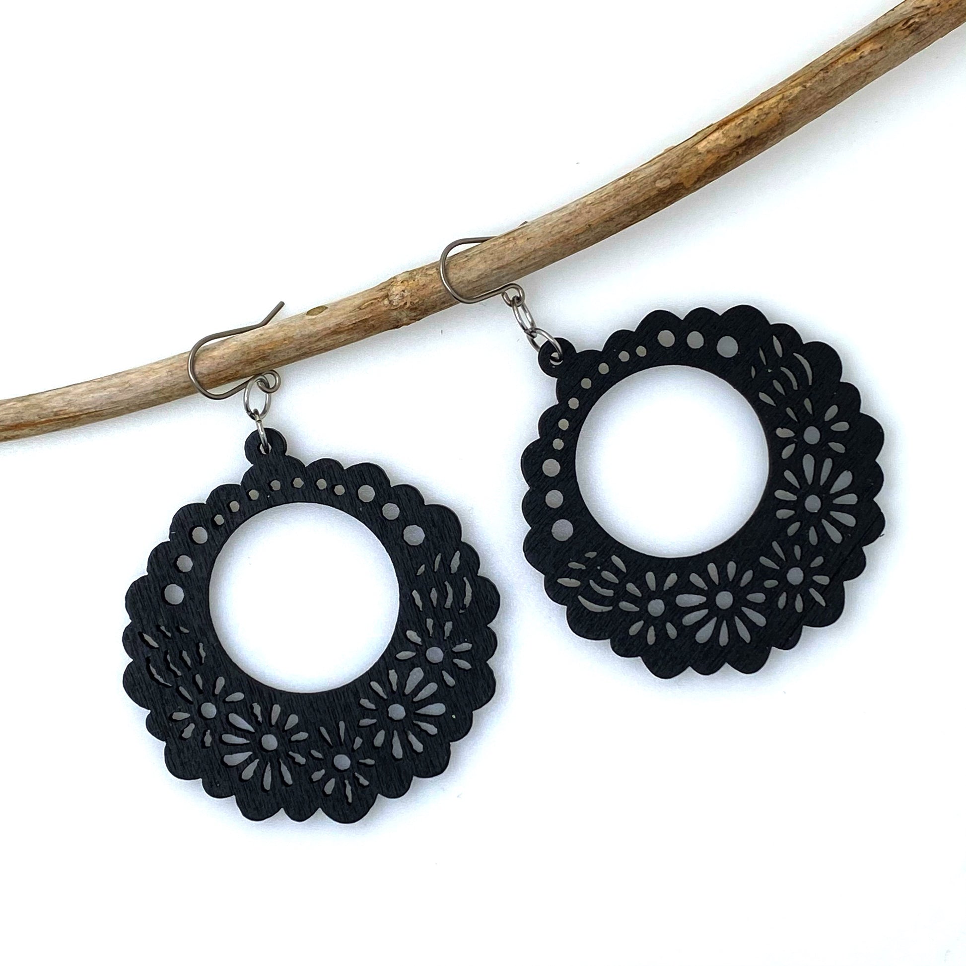 Wooden Floral earrings on a white background. black