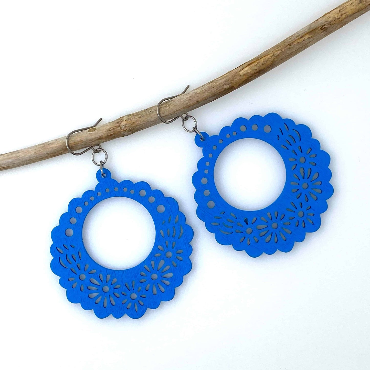 Wooden Floral earrings on a white background. blue