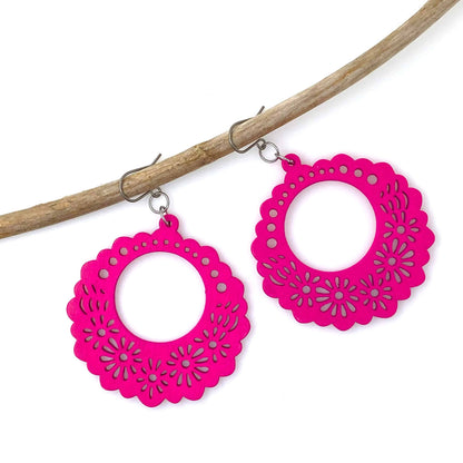 Wooden Floral earrings on a white background. magenta